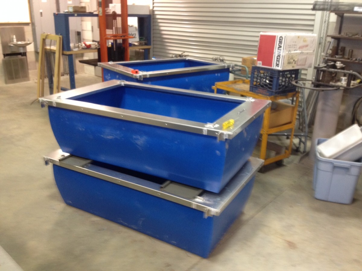 Gary and Bob welded aluminum frames around PVC tanks - our main rearing units